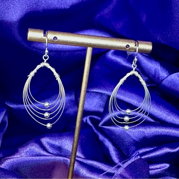Multi Hoops with moving silver balls dangle earrings. - Picture 5 of 12